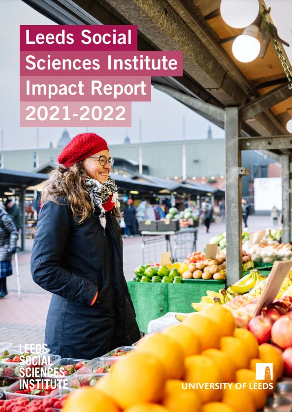 This is the front cover of the Leeds Social Sciences Institute Impact Report 2021 - 2022. It shows Sara Gonzalez at a fruit and vegetable stall in Leeds Kirkgate Market.