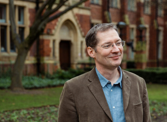 Photograph of Professor Shane Doyle outside the Great Hall at the University of Leeds